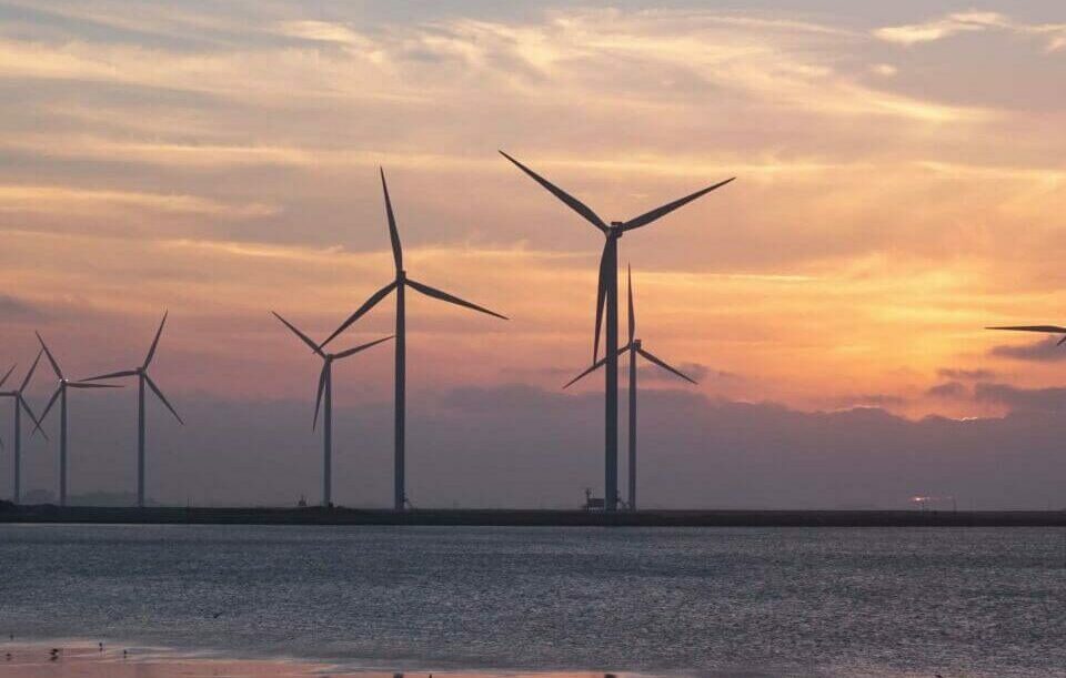 wind turbines with sunset